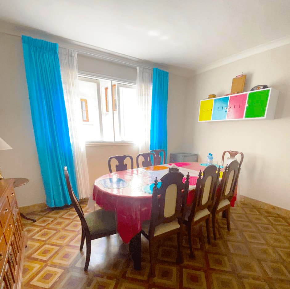 Shared dining room with natural light at Casa Yllika student housing Jesus Maria Lima Peru