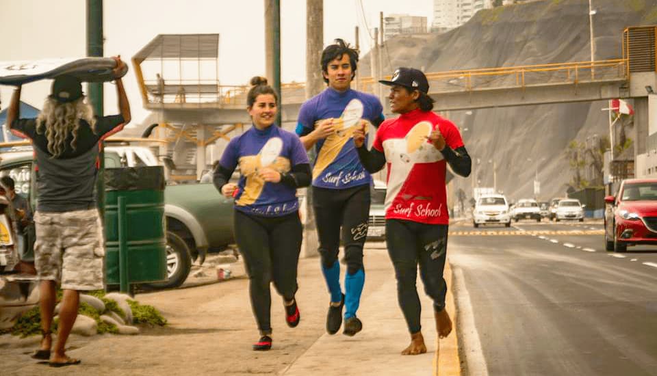 Students enjoying surf activities organized by Casa Yllika student housing in Lima Peru