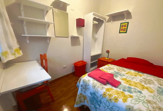 Private student room with desk wardrobe and shelves at Casa Yllika affordable student housing Jesus Maria Lima Peru