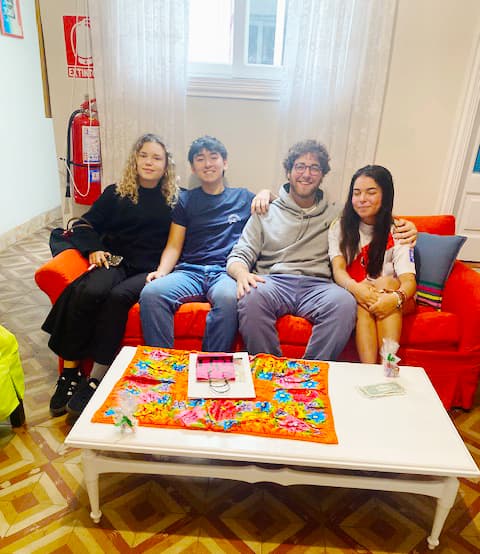 International students relaxing in common area at Casa Yllika student housing Jesus Maria Lima Peru