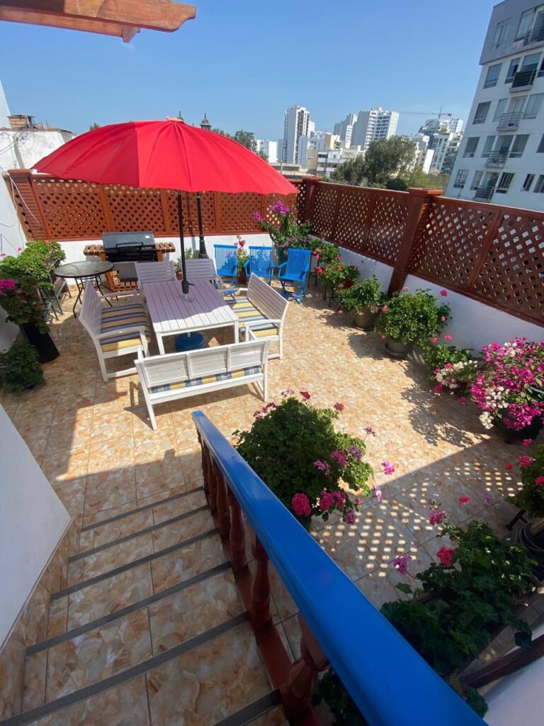 Stunning rooftop terrace with city views at Casa Yllika student housing Jesus Maria Lima Peru